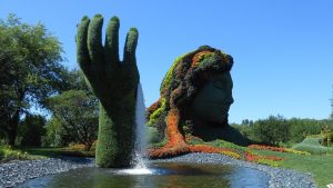 waterfall gardenscape of woman's hand and face