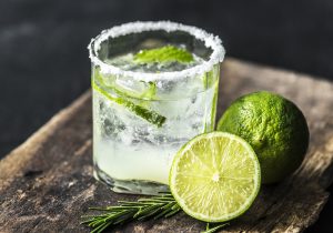 Salt on rim of glass with limes. 